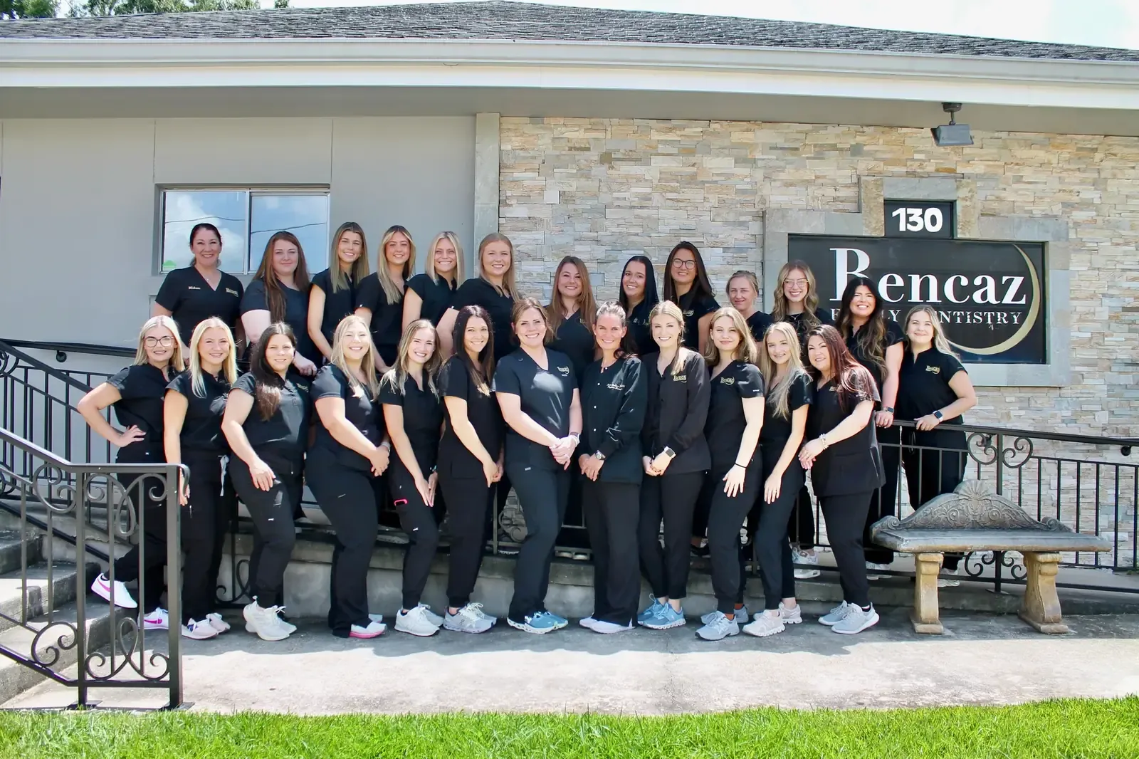 Bencaz Family Dentistry team standing outside the Denham Springs office